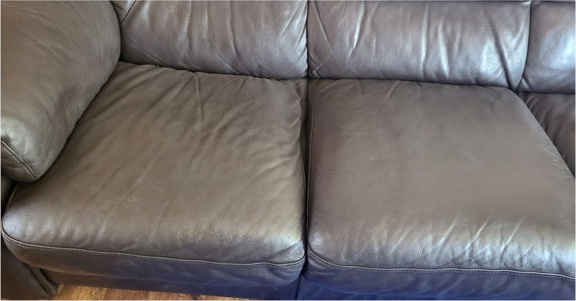 The same brown leather sofa cushions after crack repair and recolouring