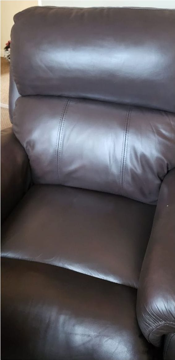 The same leather recliner armchair after the seat split was repaired and recoloured